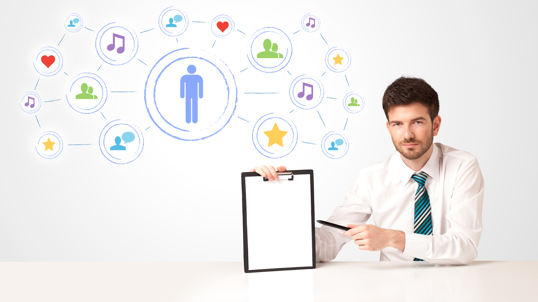 Businessman sitting at white table with social media connection background