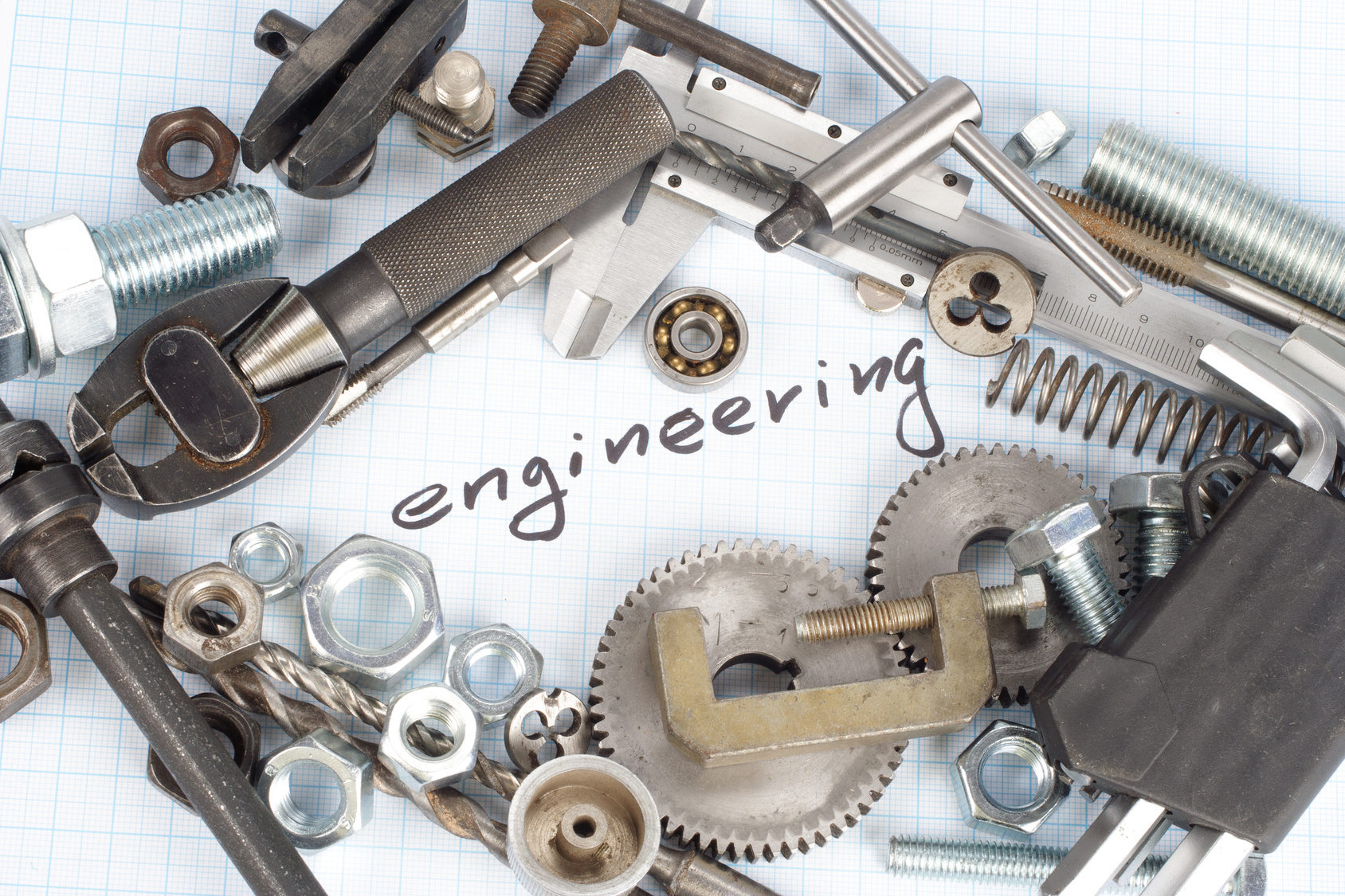 "engineering" - repair parts on graph paper background
